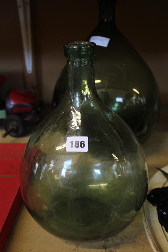 2 green glass bottle vases